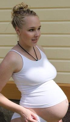 Pregnant Blonde Showing Her Full Belly