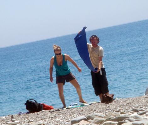 German with big tits strips naked on the beach