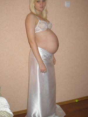 Pregnant blonde with beautiful eyes